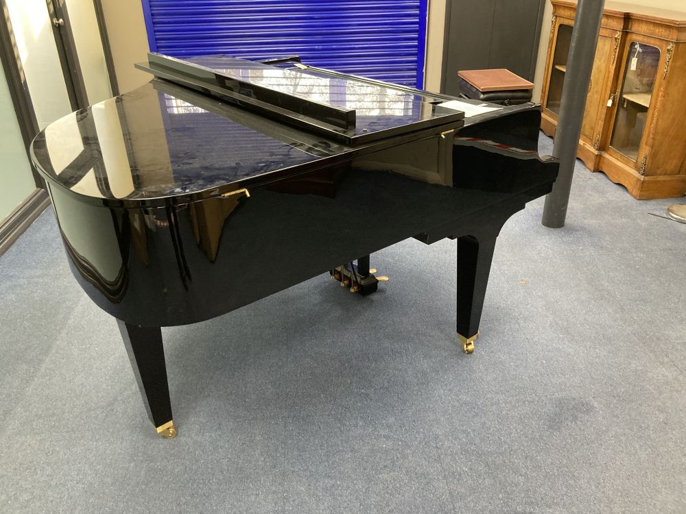 A Kawai baby grand piano, in a bright polyester finish case, on square tapered legs, together with matching adjustable stool